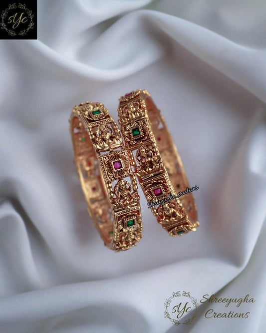 Antique Gold Lakshmi bangles with Ruby, Emerald stones