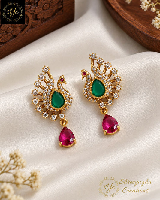 Vadivu peacock earrings.